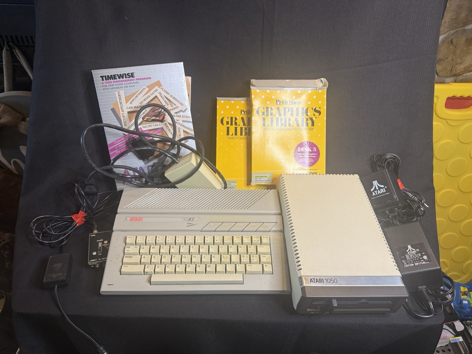 Atari 130 XE/Atari 1050 Bundle W/ Cords And Extras (Powered On) Atari 130 XE/Atari 1050 Bundle W/ Cords And Extras (Powered On)