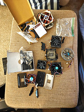 Lot Of CPU Cooler Heatsinks, Fans, And Mounting Hardware picture