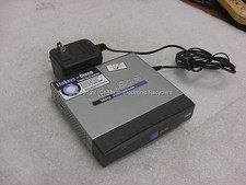 Linksys sd208 8-port 10/100 switch w/ Linksys ad12/05a power adapter picture